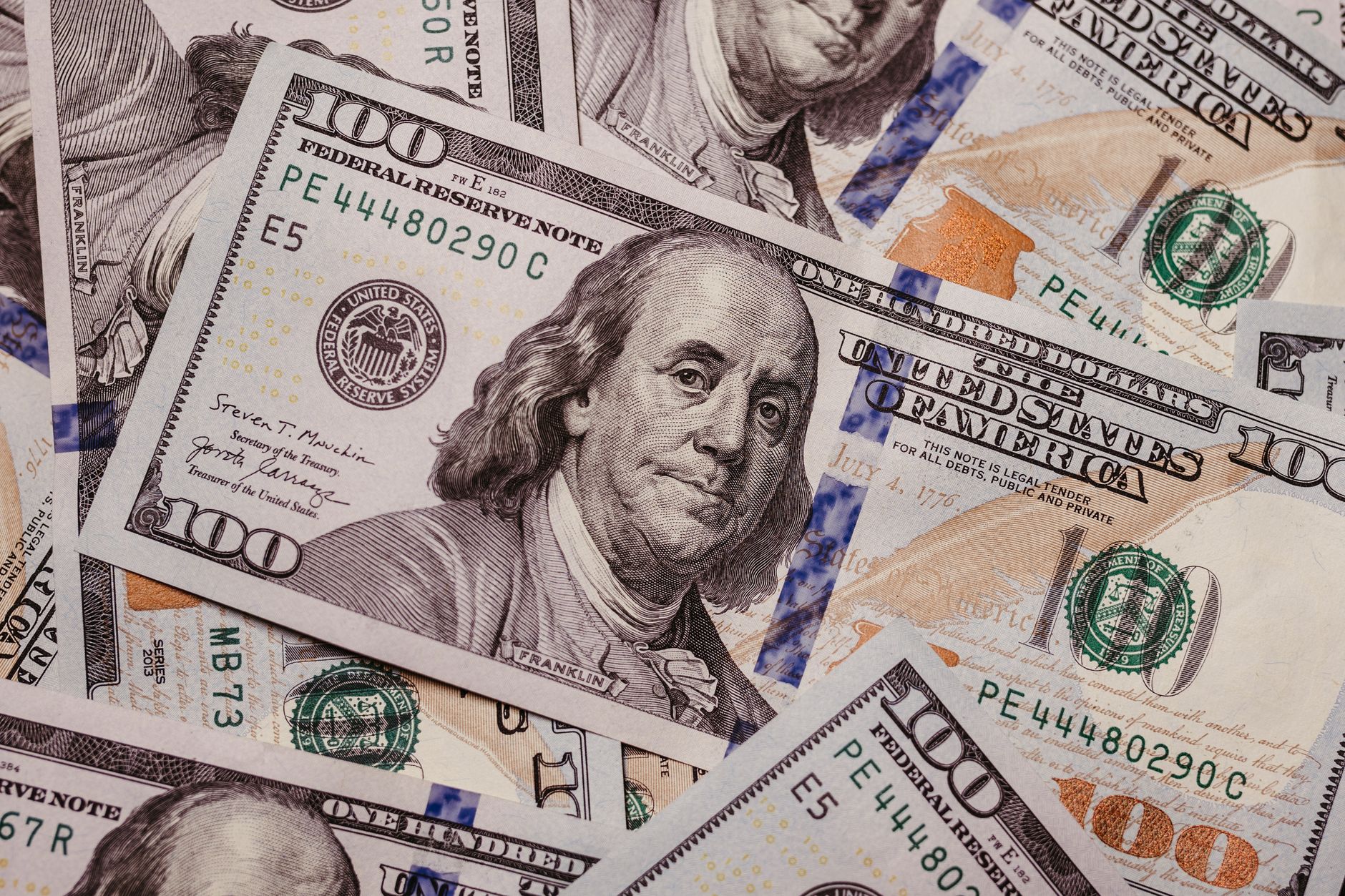 High-resolution image displaying a variety of US dollar banknotes in focus, symbolizing finance.
