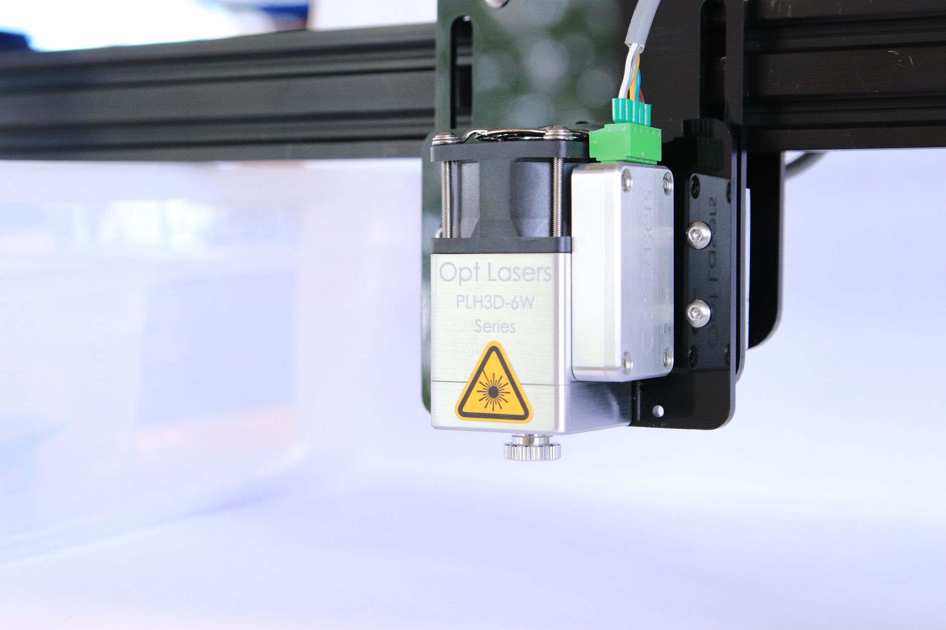 High-quality image of a laser engraving machine head, showcasing its components and precision.