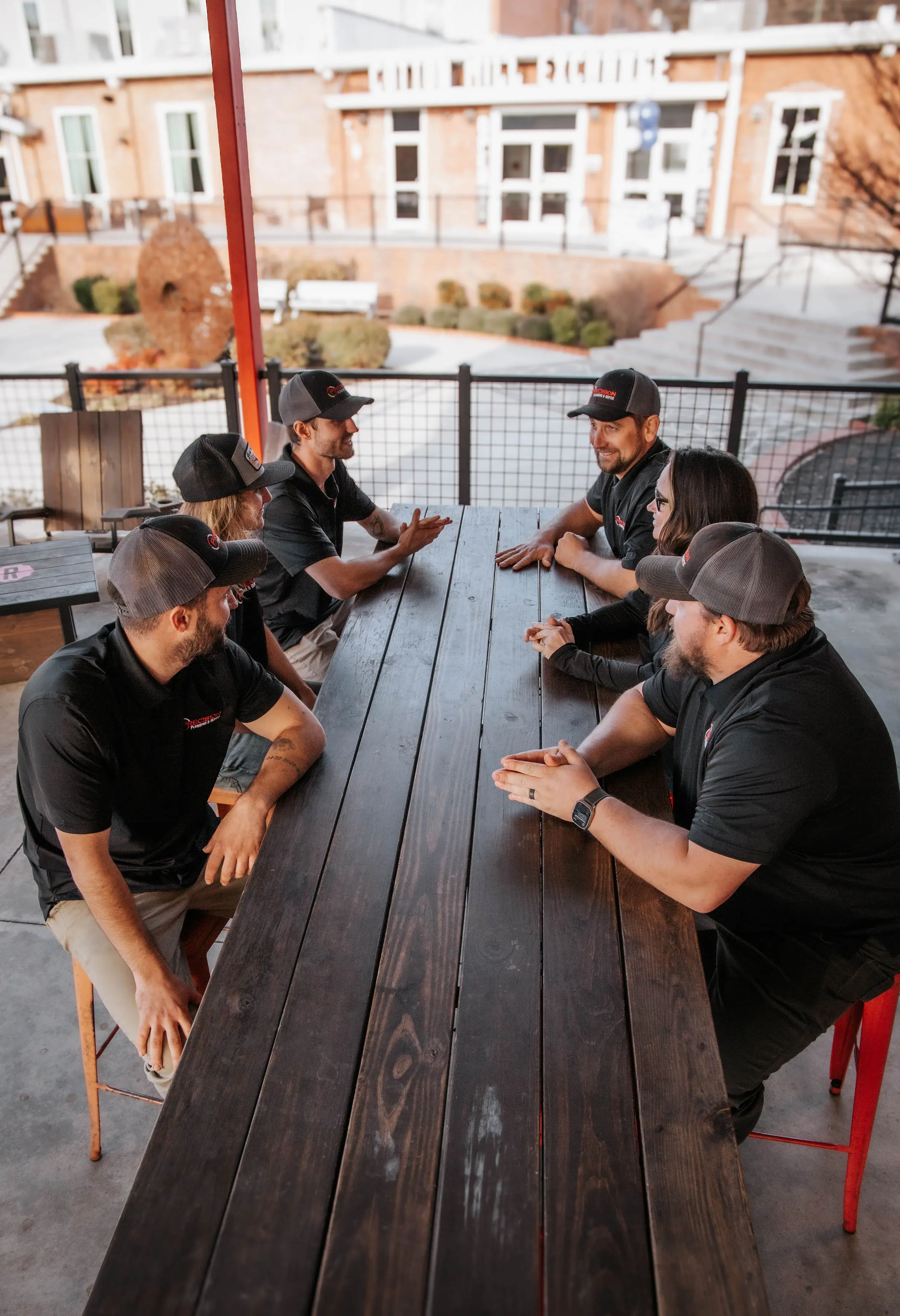 Precision Plumbing team on job site