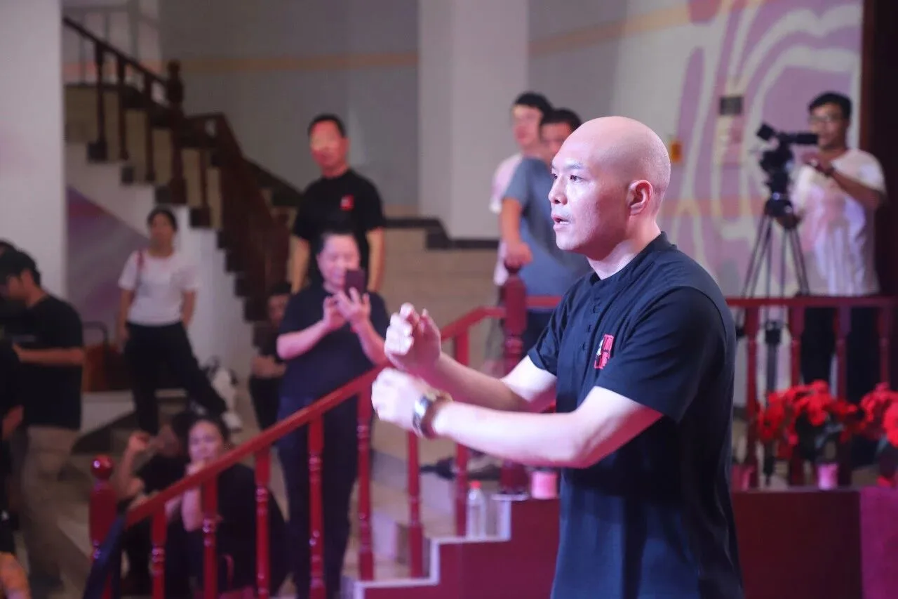 Wang Zhanjun demonstrating Tai Chi form to students
