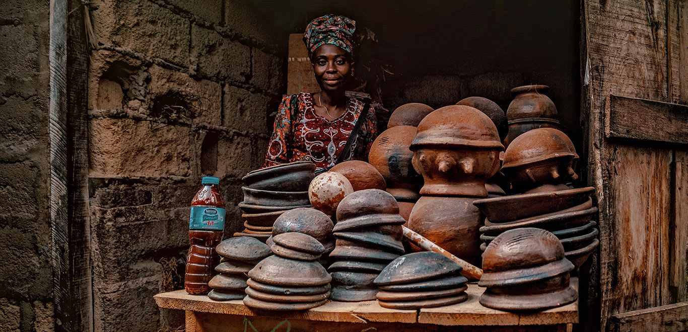 Woman selling clay and ceramic pots in Abeokuta, Nigeria