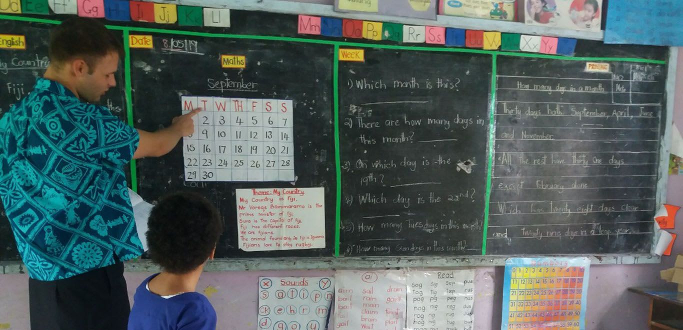 Teaching in a classroom in Fiji