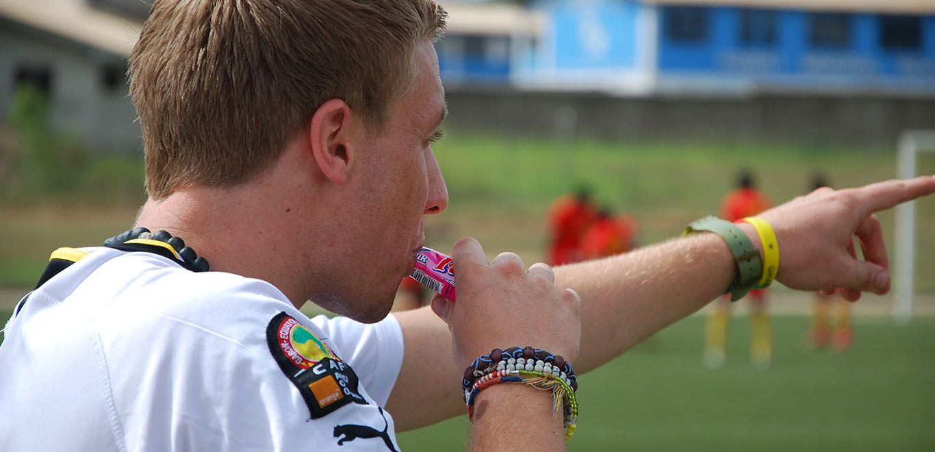 Coach blowing a whistle