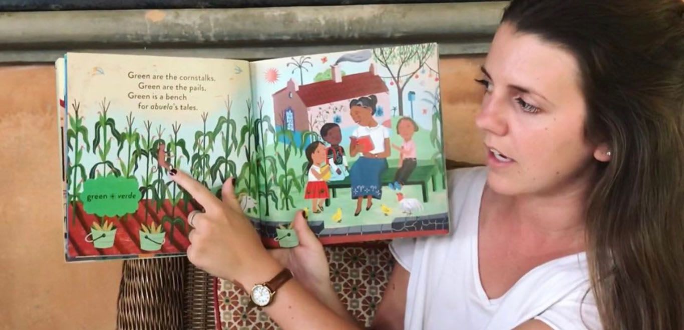 Teacher in Kenya showing a book