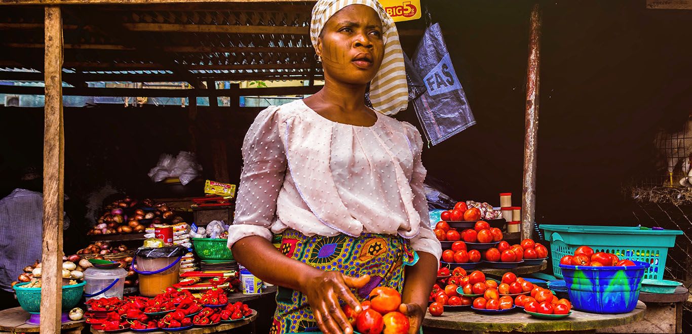 Woman selling produce in Kenyan market