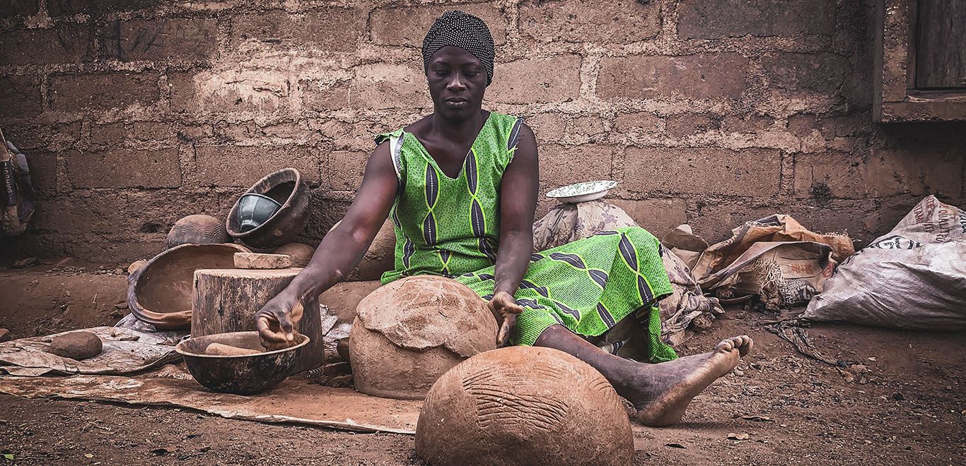 Kenyan woman making claypots 