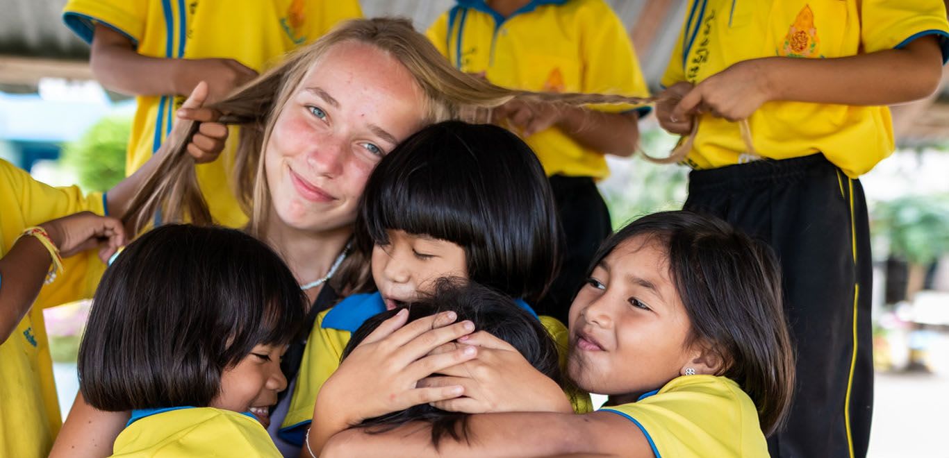 Teacher with her kids in Thailand