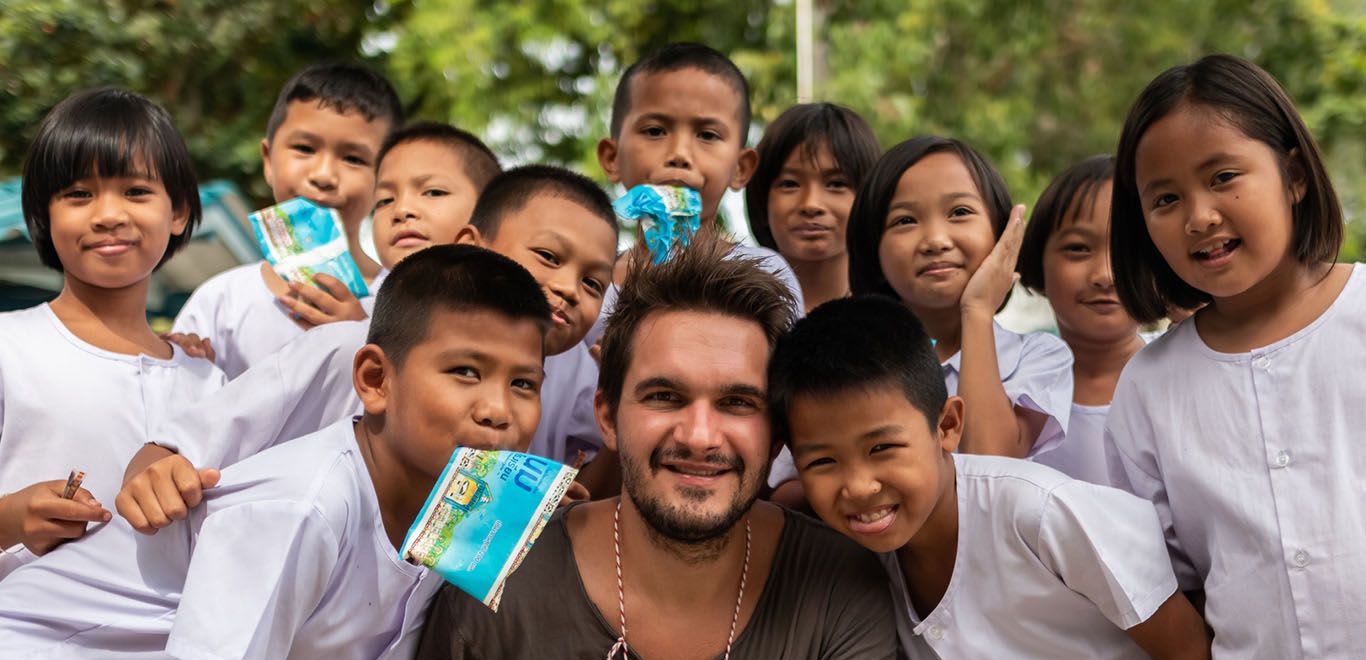 Teacher with his kids in Thailand