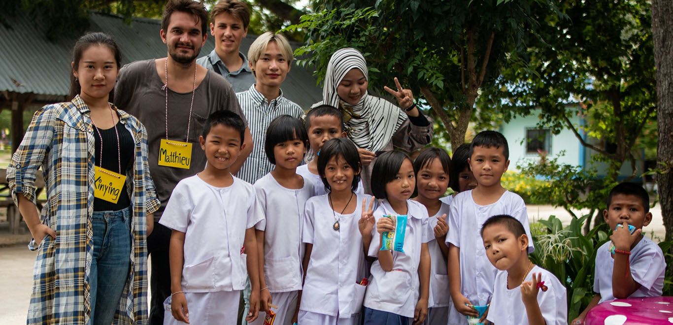 Volunteer teachers with their students in Thailand