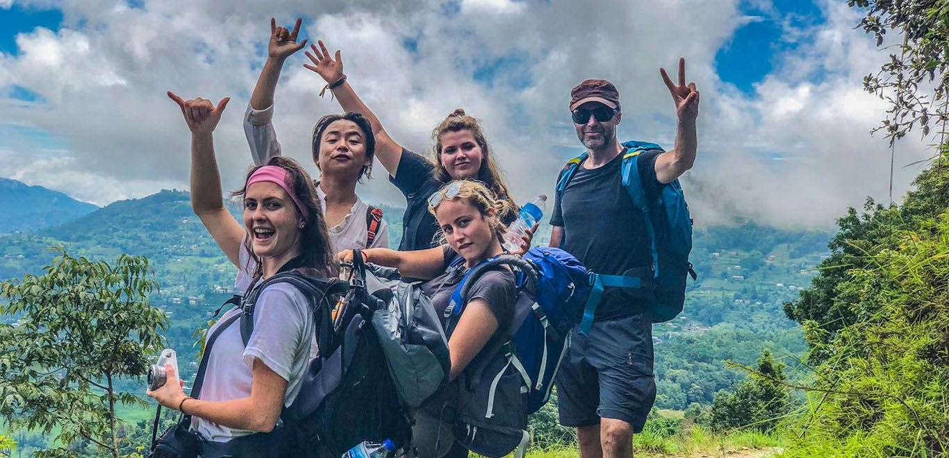 Group shot of hikers with scenic views