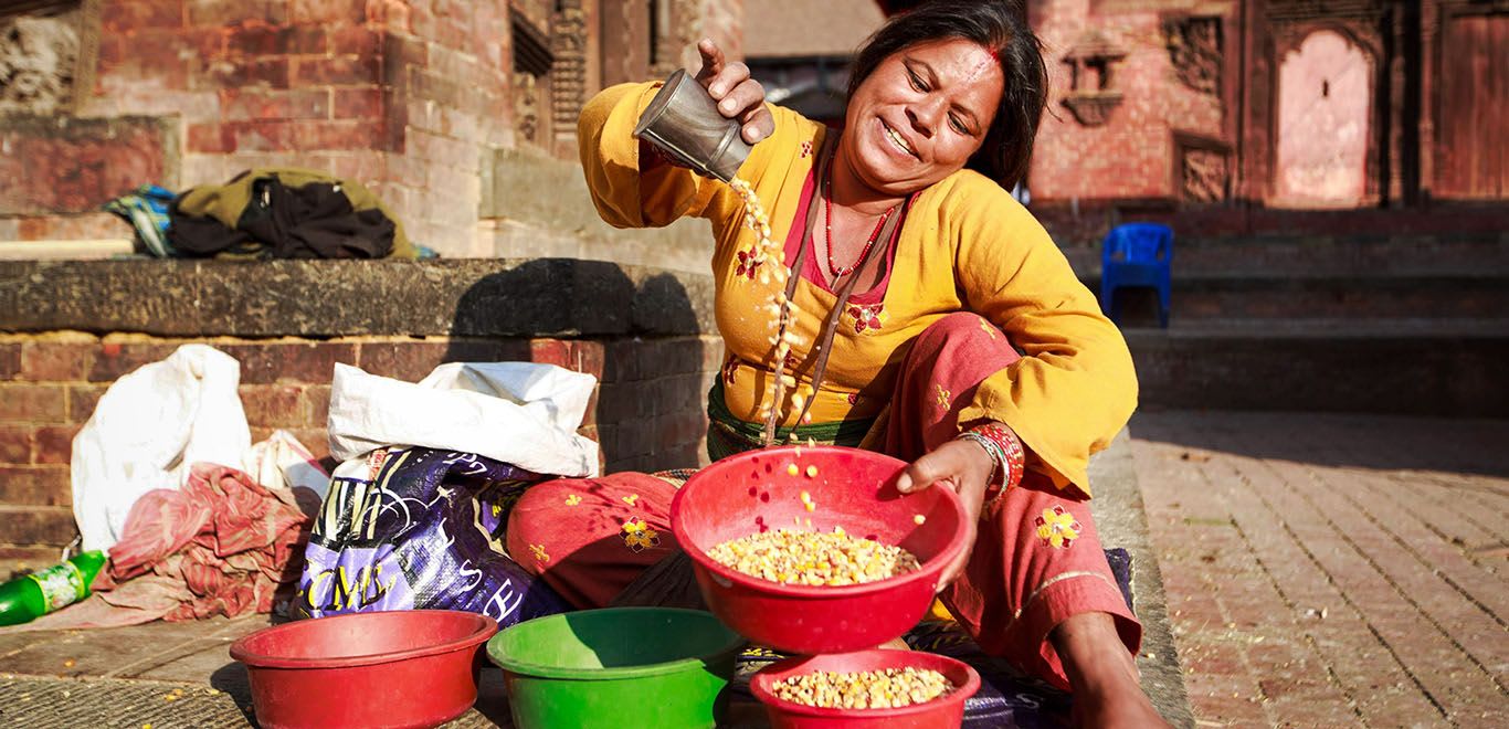 Woman selling food on the street in Nepal