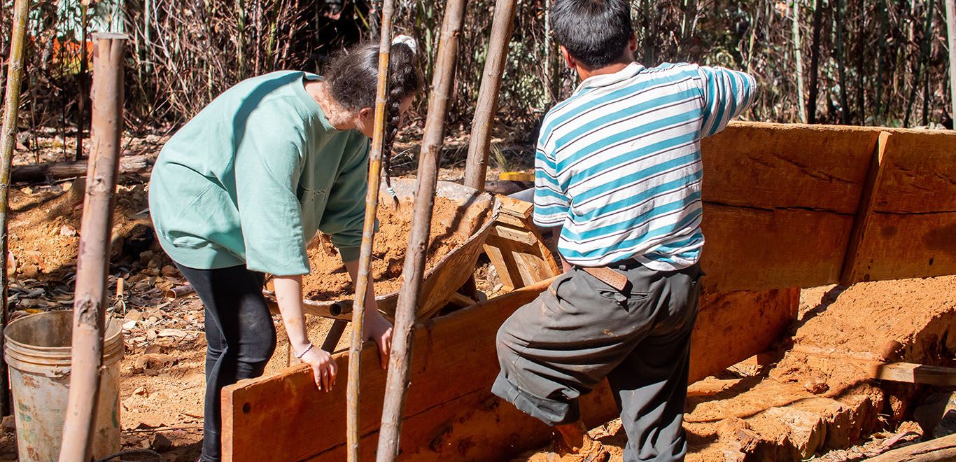 Mixing mud in Peru