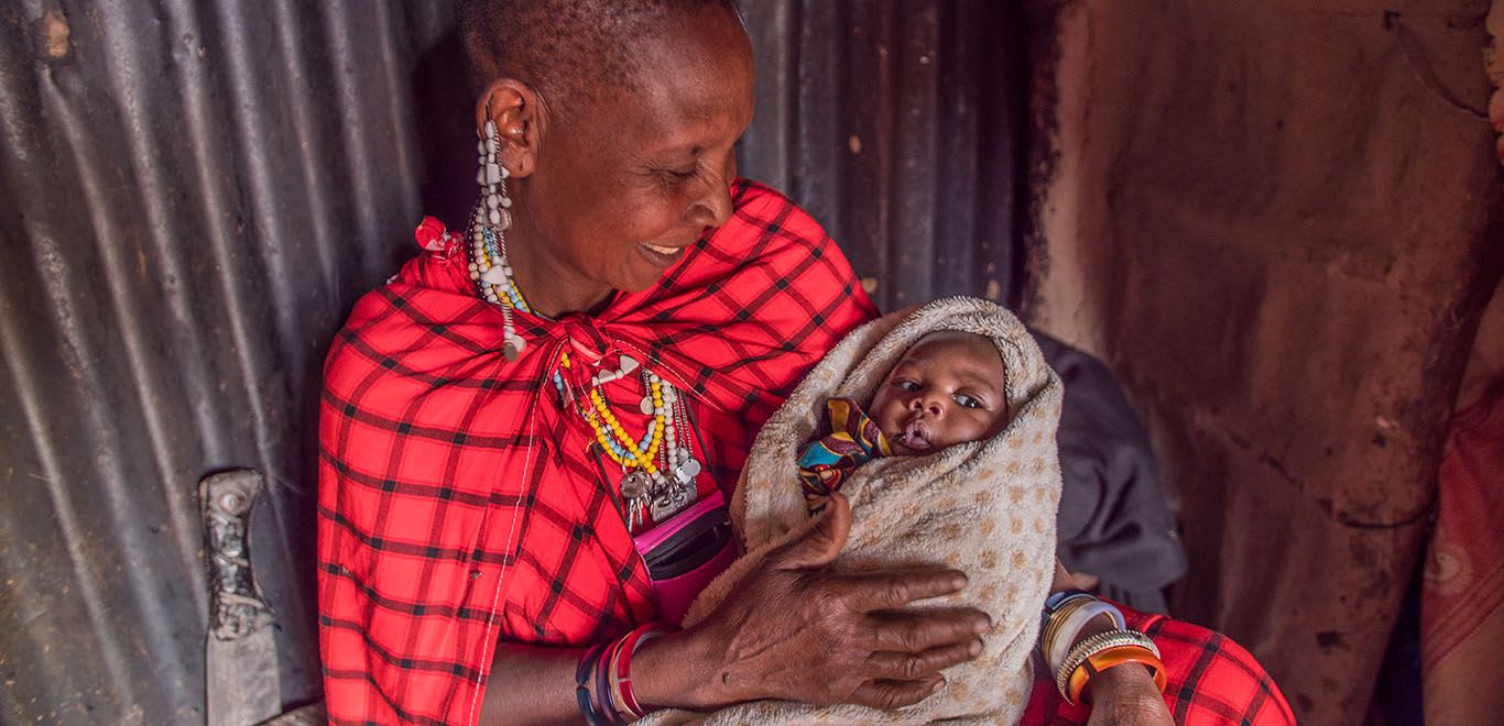 Woman caring for her baby in Tanzania