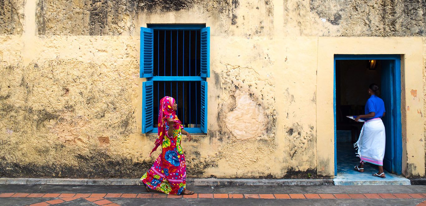 Lady walking in a town in Zanzibar