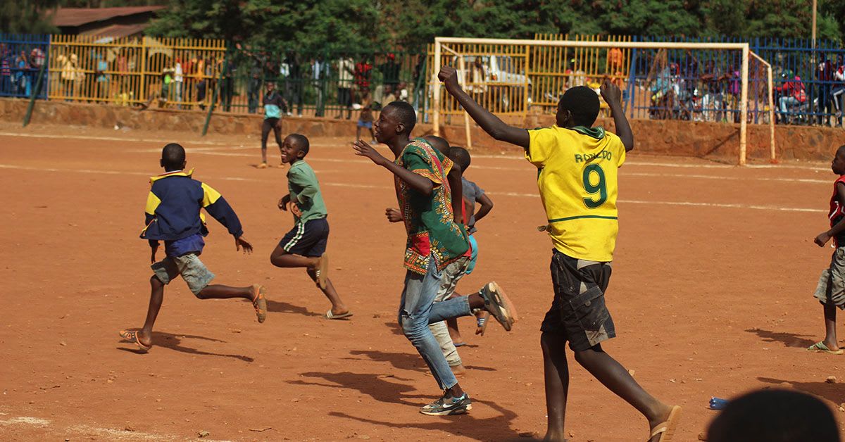 Team playing soccer in Zambia