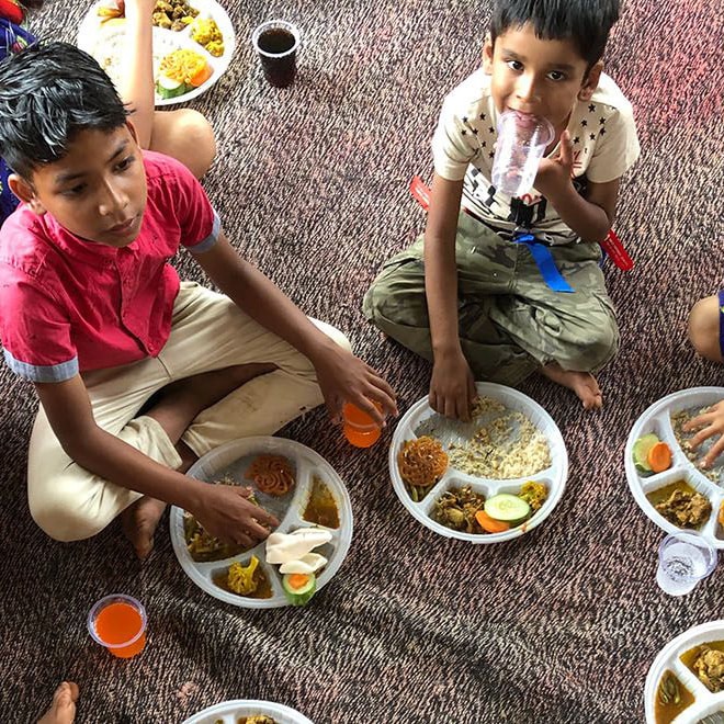 Kids in Nepal eating lunch