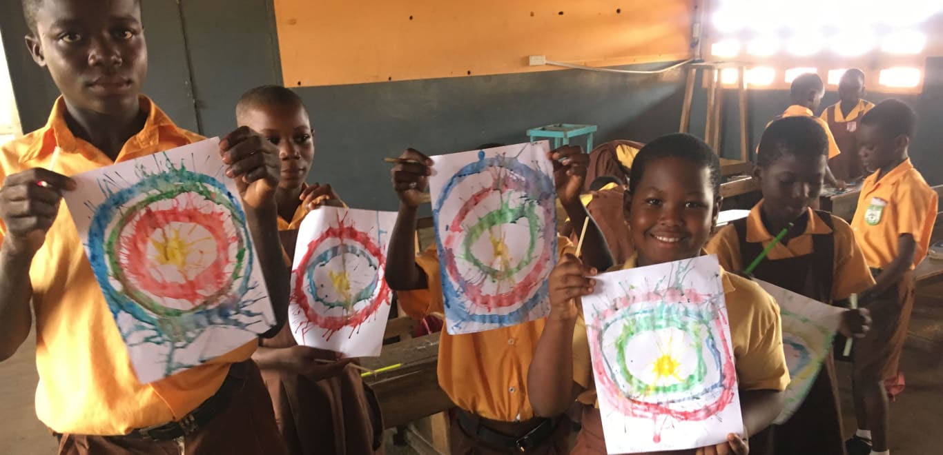 Students with their artwork in Ghana