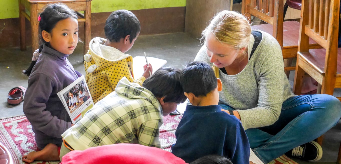 Volunteer in classroom in India