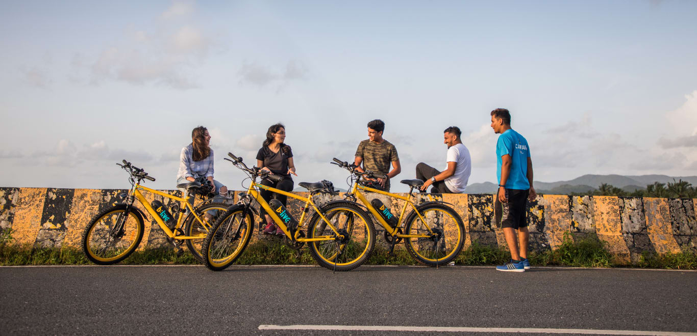 People on a bike tour in Goa, India