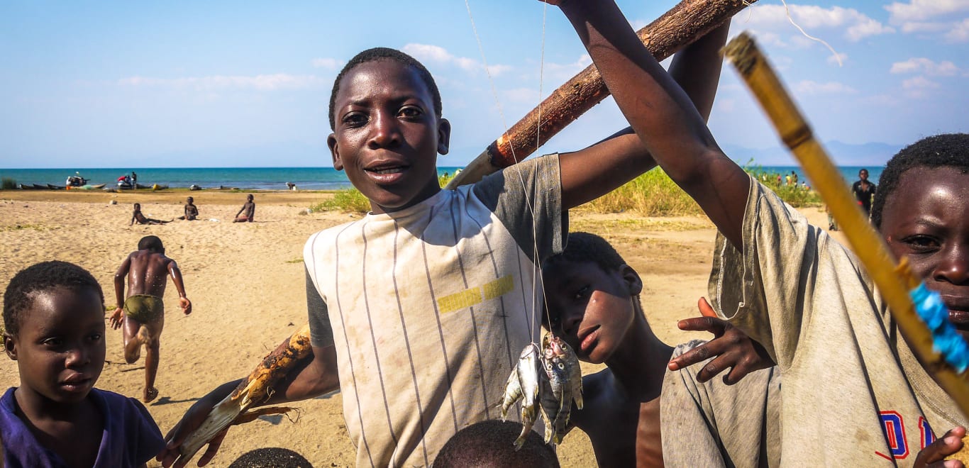 Kids with Fish in Malawi