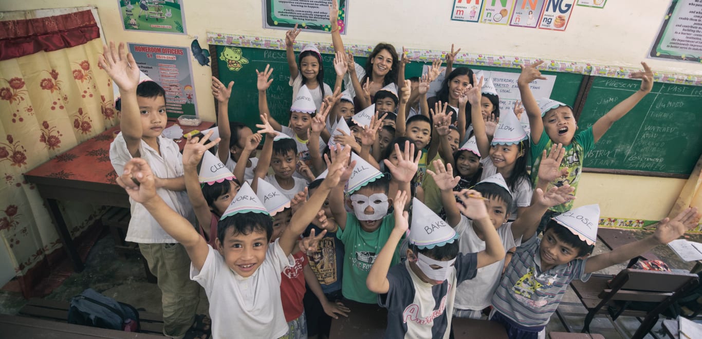 Volunteers and Kids in Classroom in Palawan, Philippines.