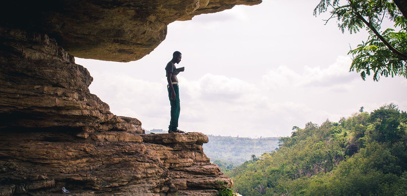 Man on a cliff with scenic views