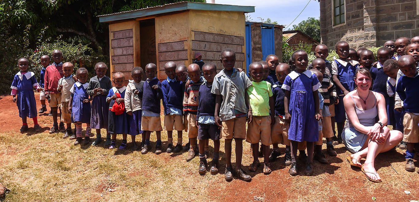 Teacher with her class in Kenya