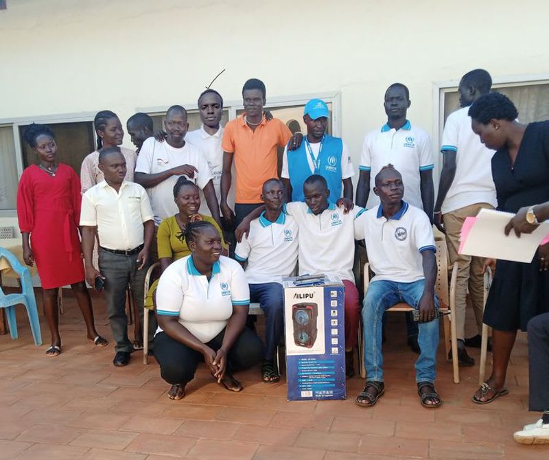 Simon Awan Mabur working with team