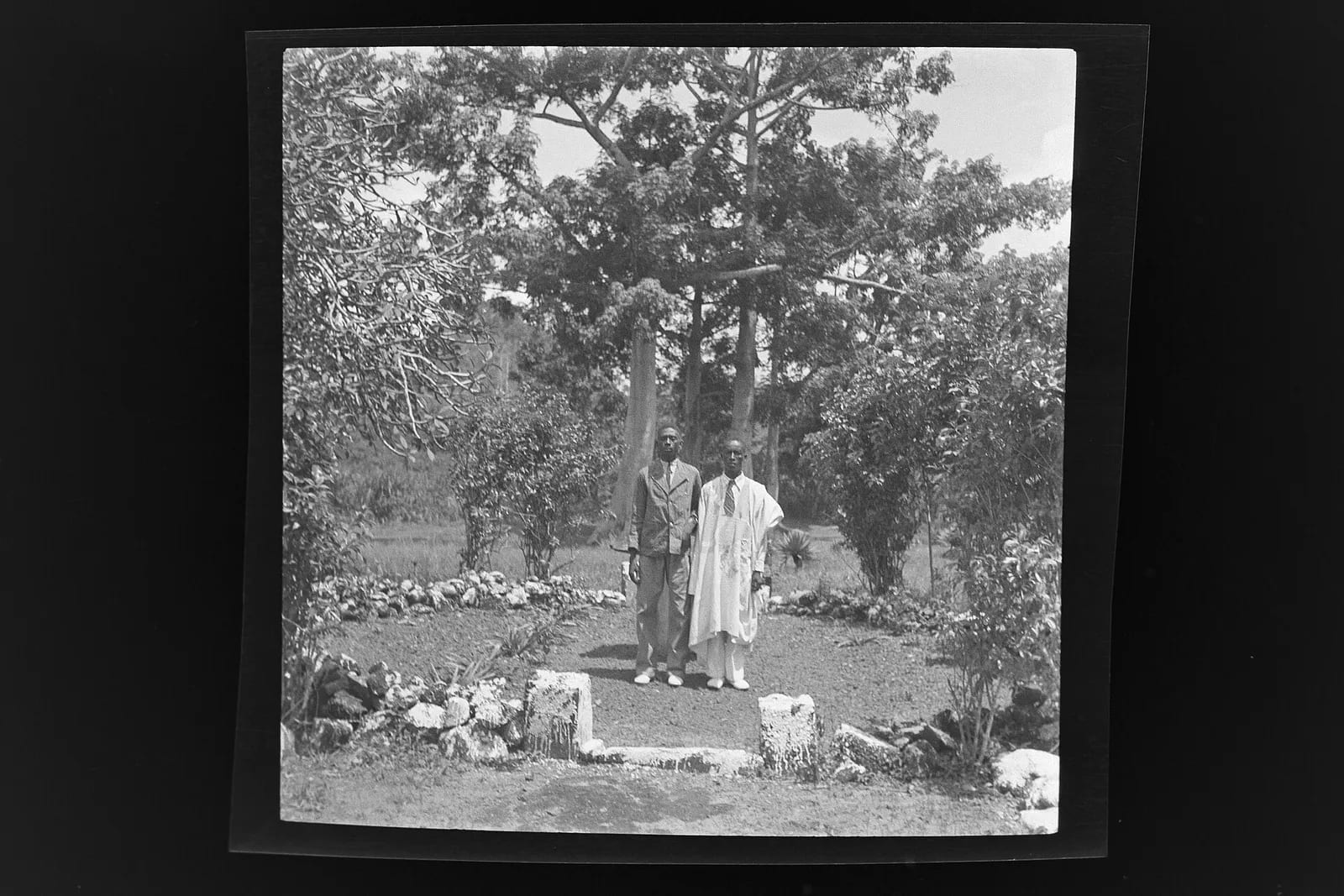 Two man standing in the yard of the guesthouse