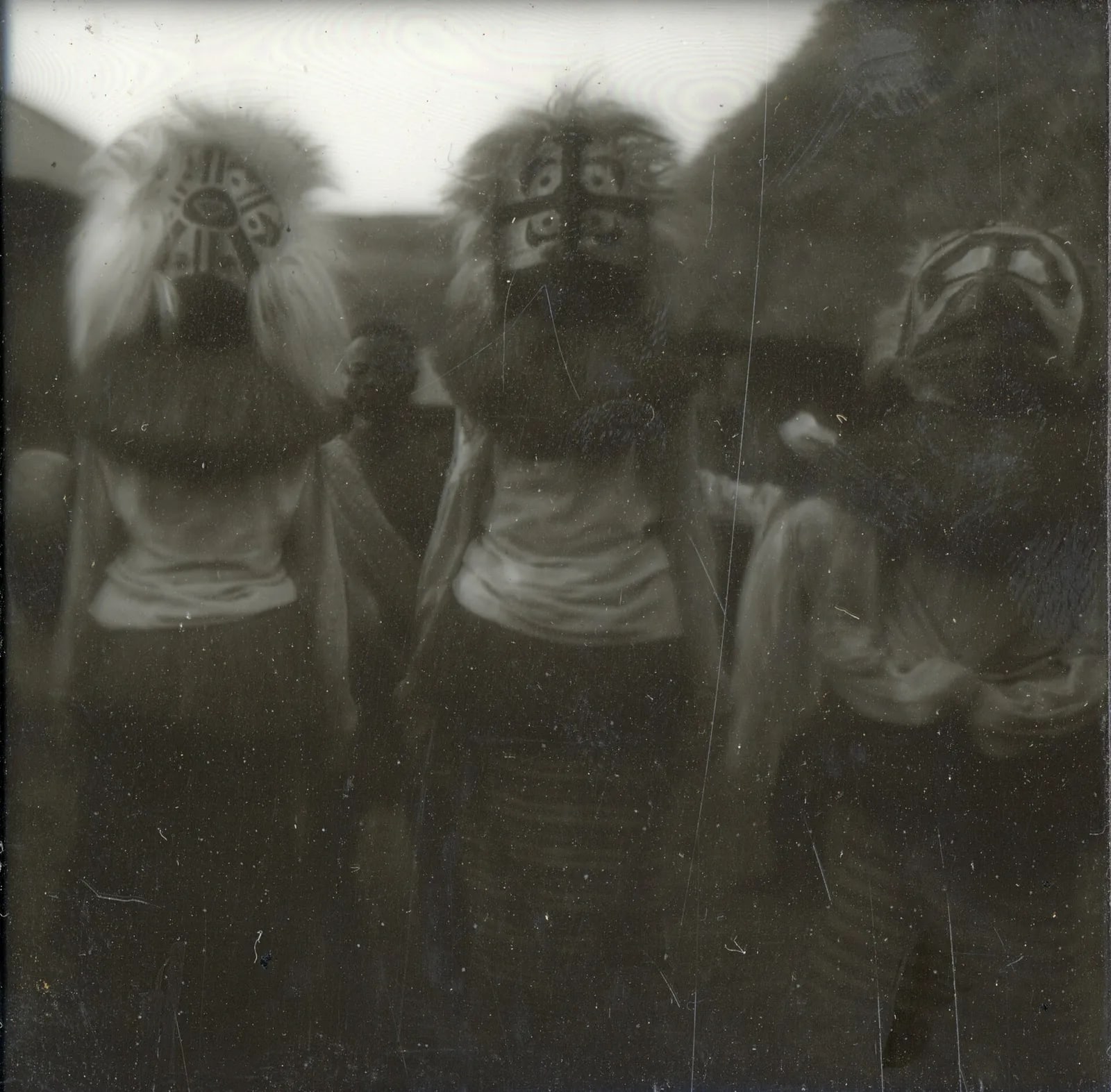 Three masqueraders at a dance, possibly Poro 'nafali', Panguma