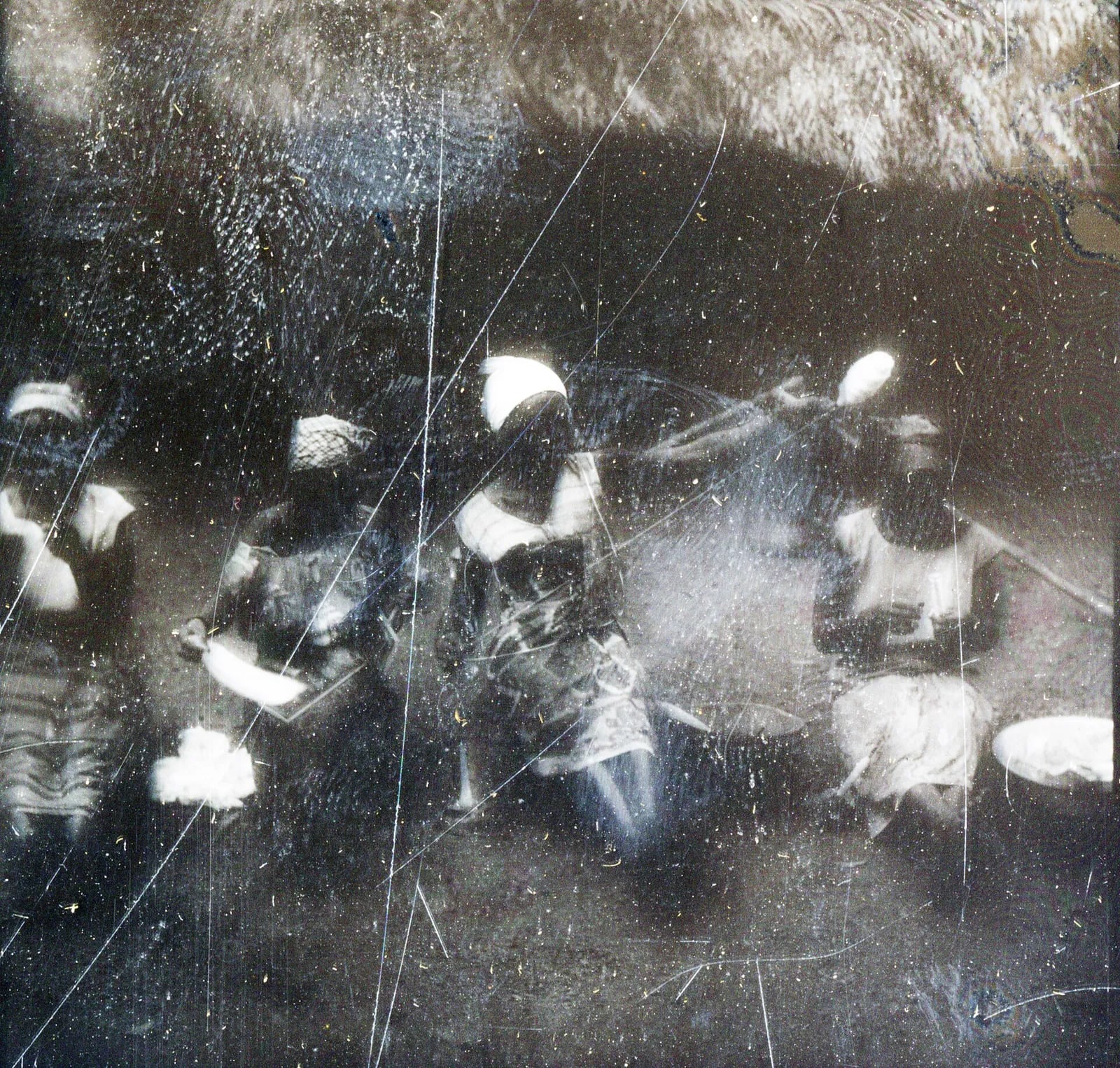 Four women spinning cotton in front of a house, Panguma