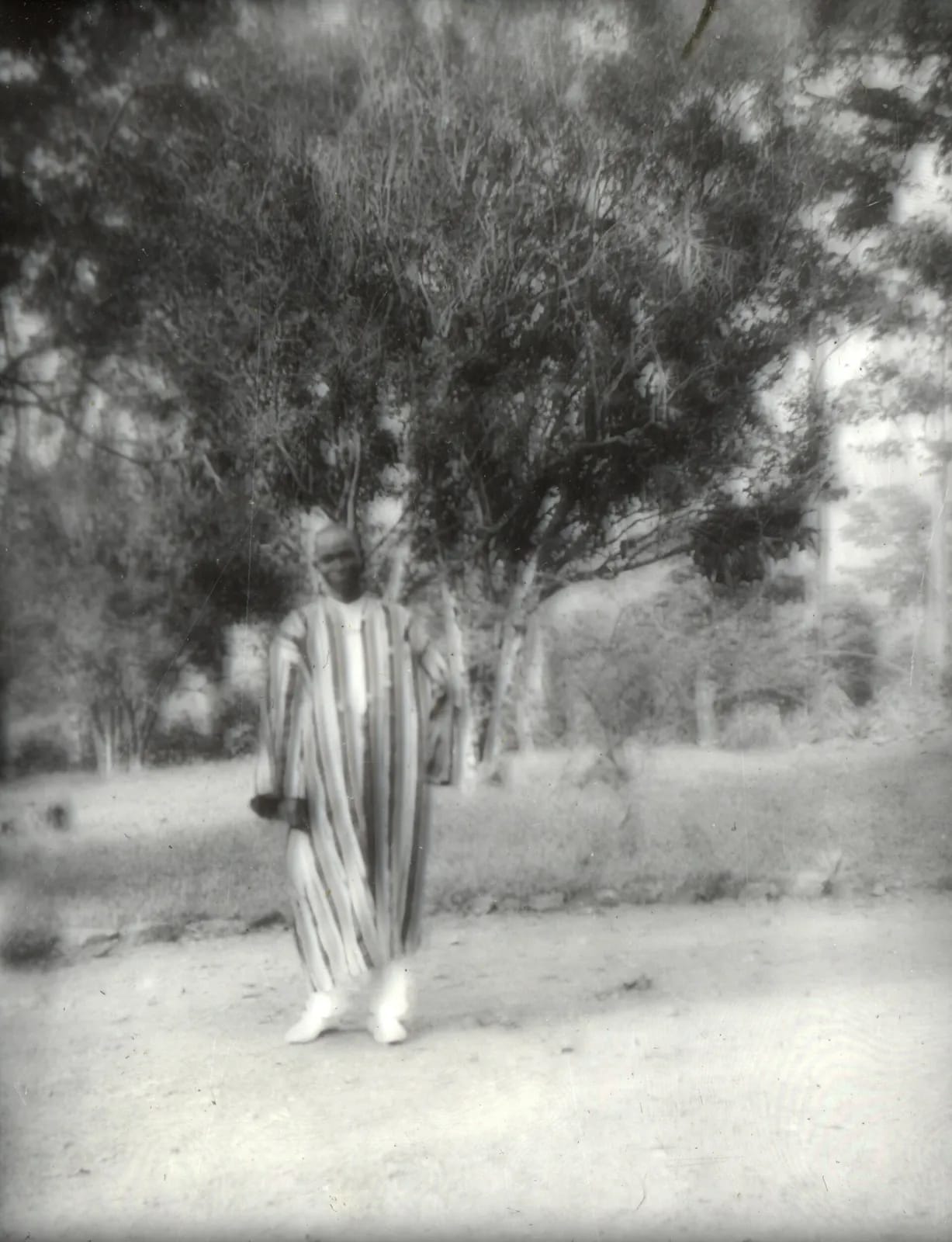 Thomas Conteh, Hofstra's interpreter, in the guesthouse yard, Panguma