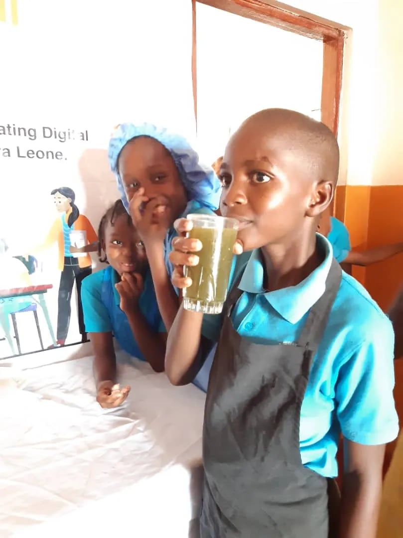 A pupil drinking Bitter Leaf water