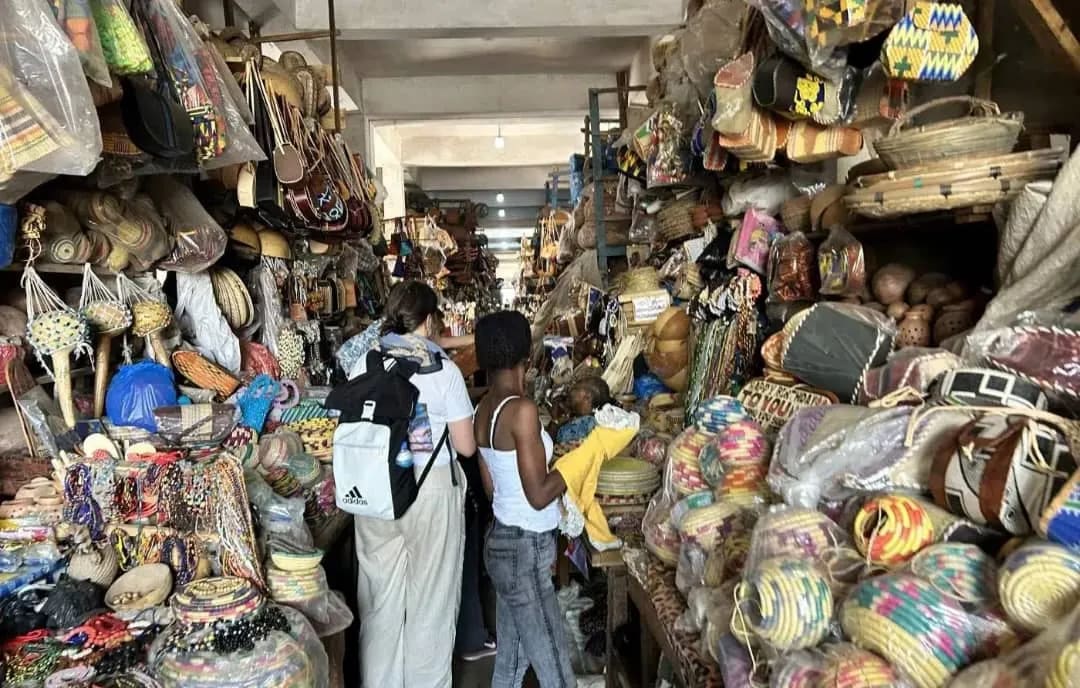 A tourist shopping at the Sierra Leone Big Market