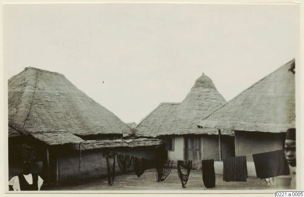 Inside a Mende town: houses and cloth drying, 1930–31