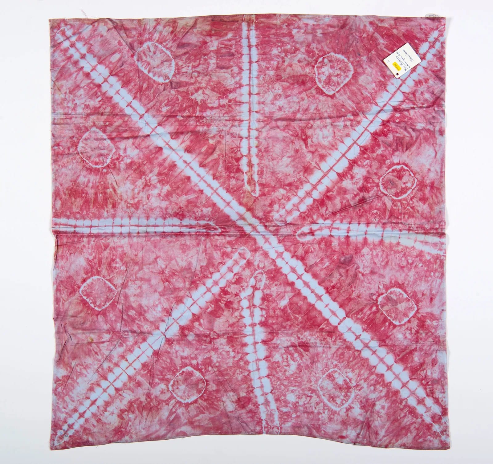Gara headscarf, pink-red with tied circles, made by Kadiato Kamara