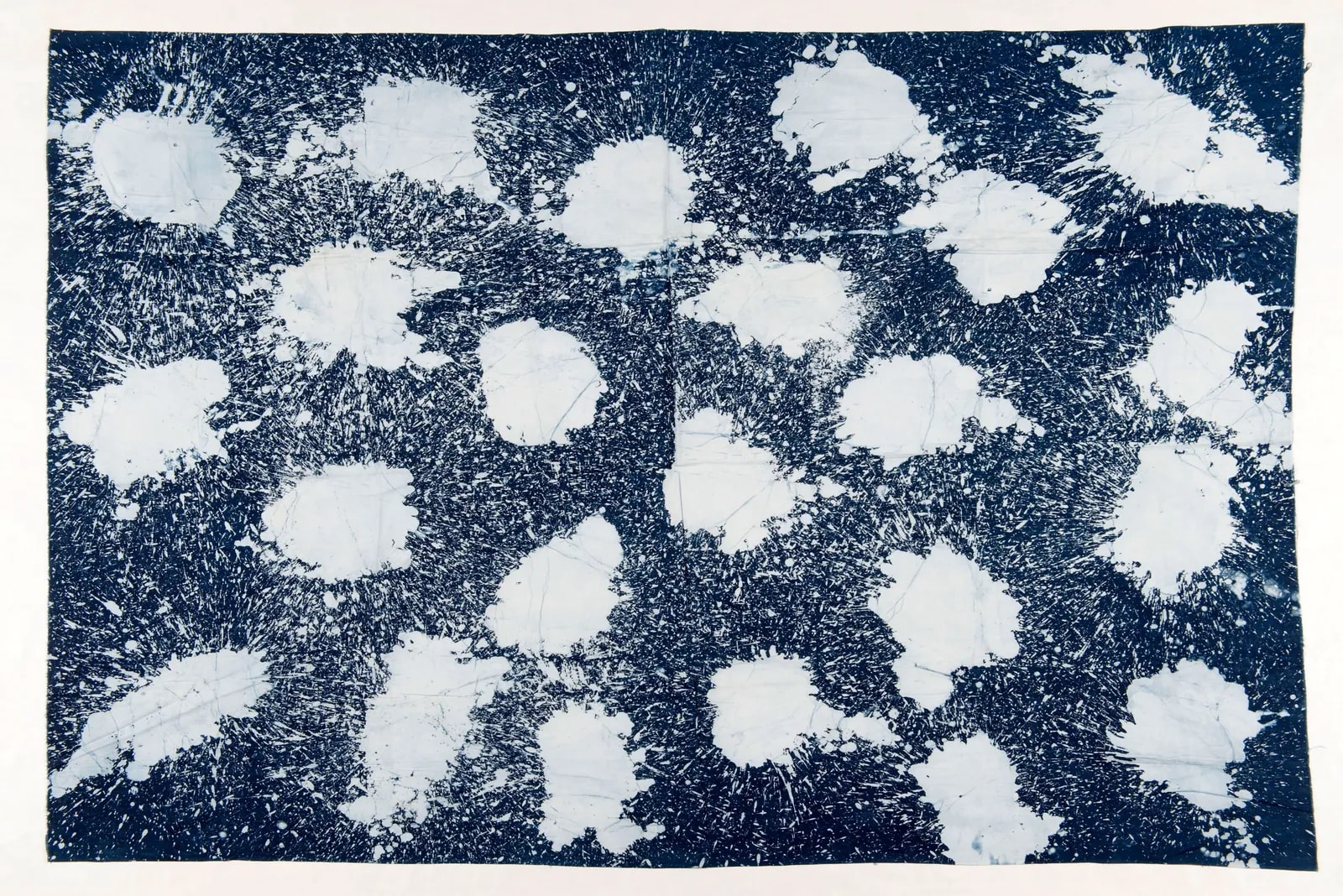 Blue wax-resist cloth with large white patches