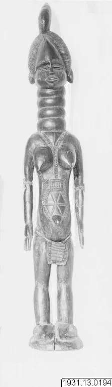 Bundu (Sande) society figure in an embroidered apron