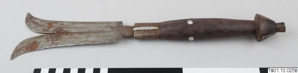 Knife with a carved blade