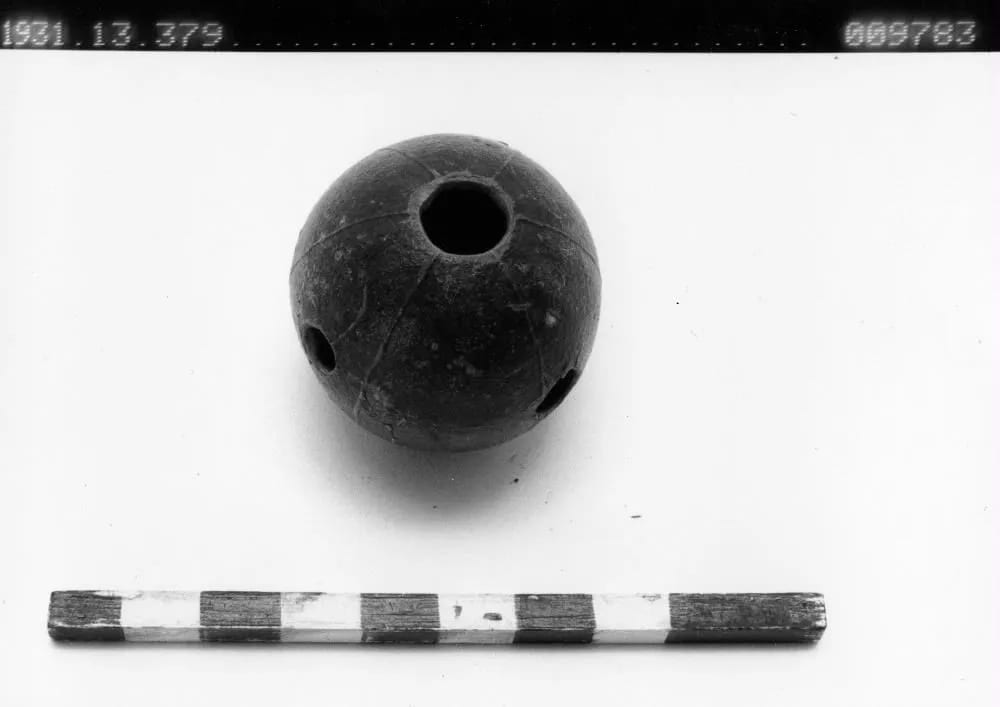 Whistle of a hollow fruit, blown by Poro initiates, Vai