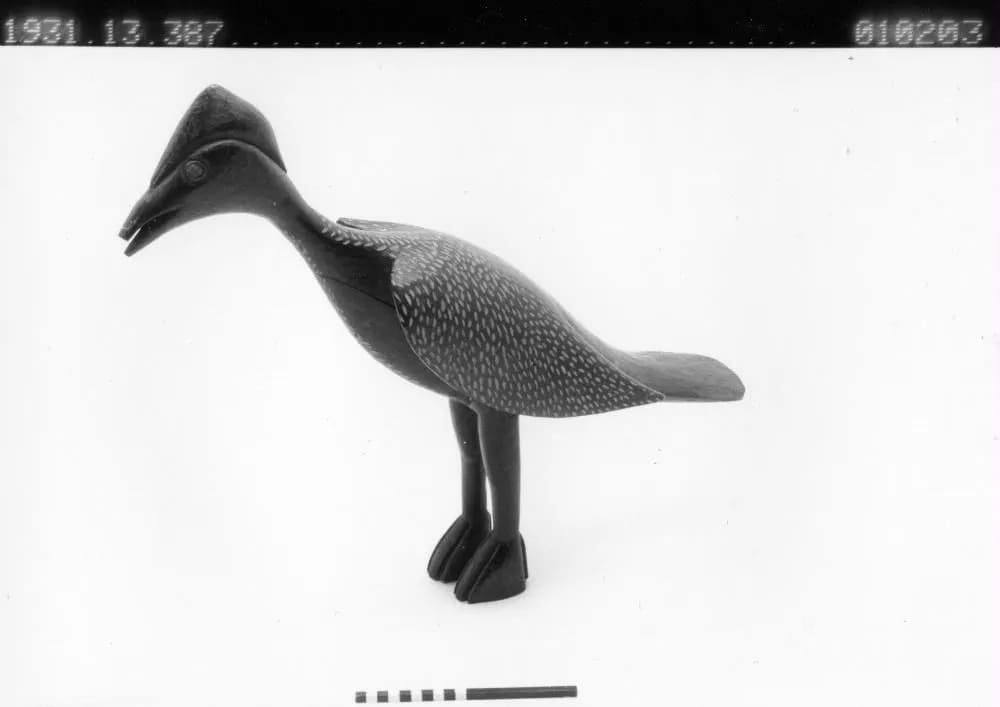 Carved bird, black with white spots, Vai