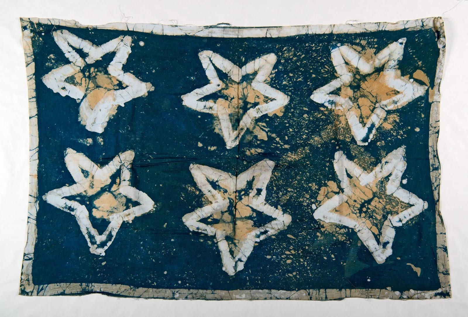 Green wax-resist cloth with six stars