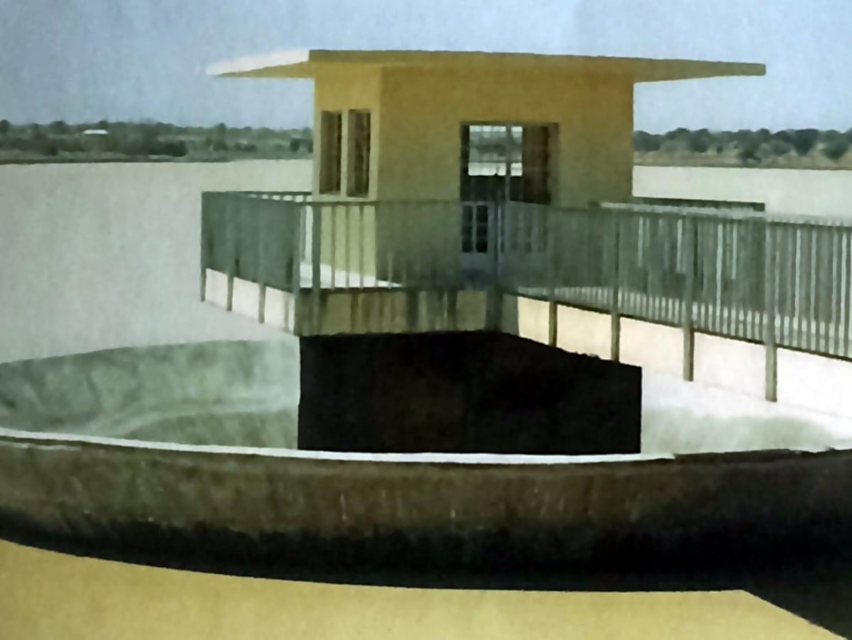 The completed bell-mouth spillway and control house on the Kubanni reservoir