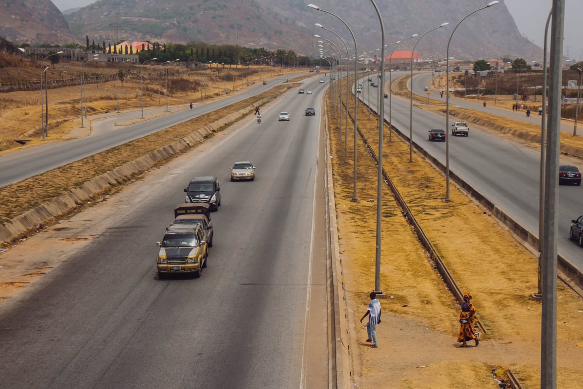 A dual carriageway running between hills