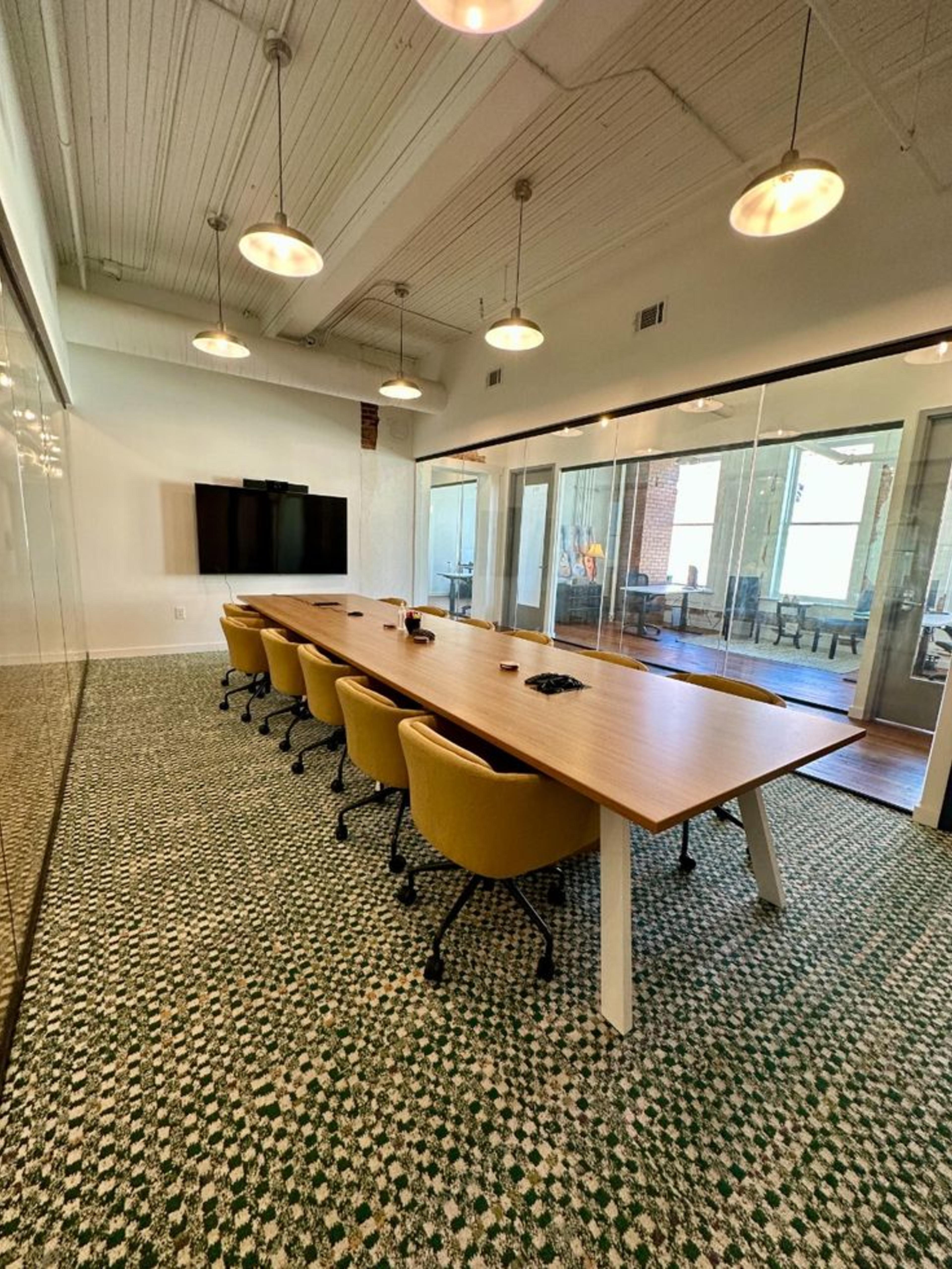 Modern workspace with beige chairs and tables in a coworking space for rent in Bangalore