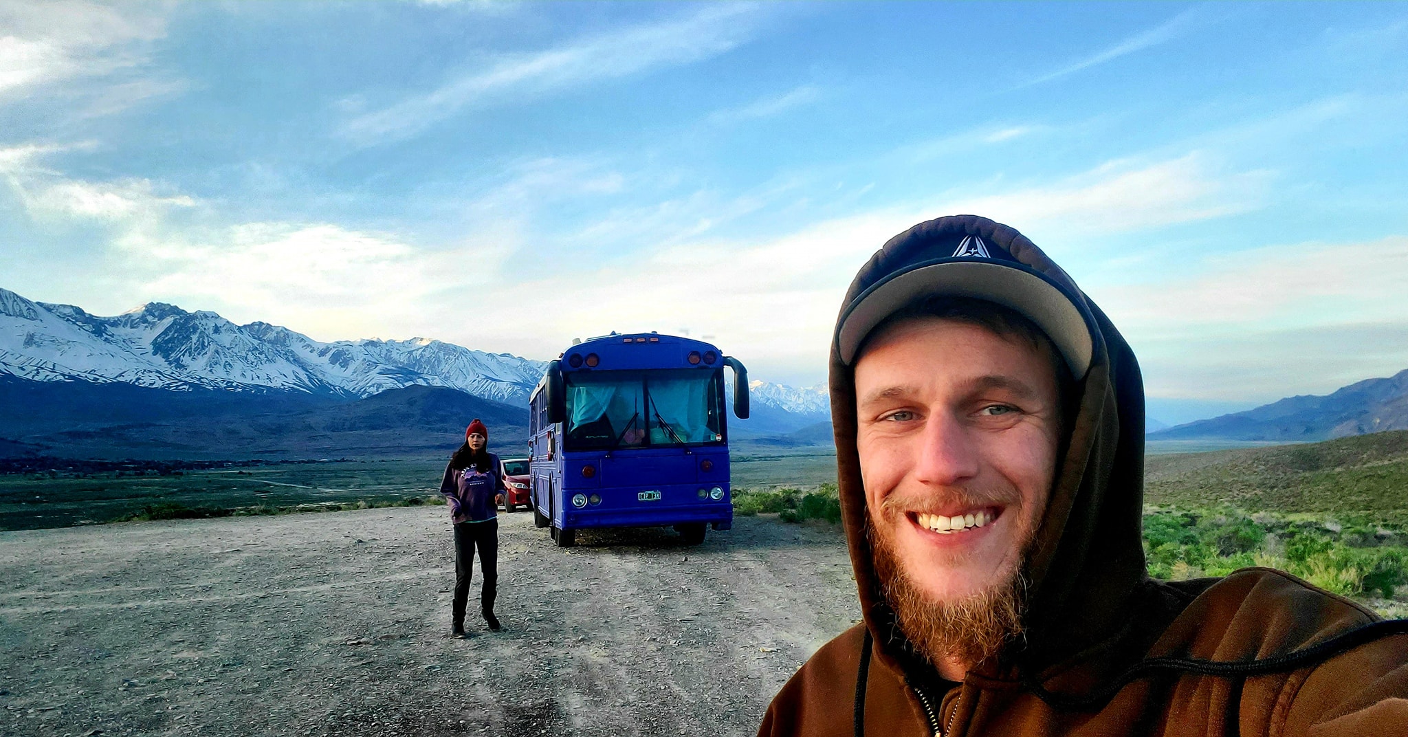 James and Melissa Jernigan Standing in Front of Skoolie in California