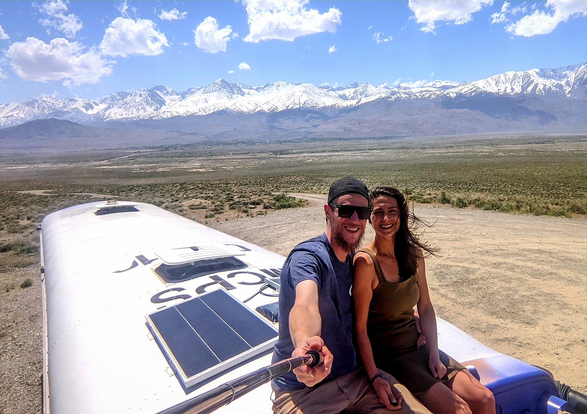 James and Melissa on Roof of Skoolie