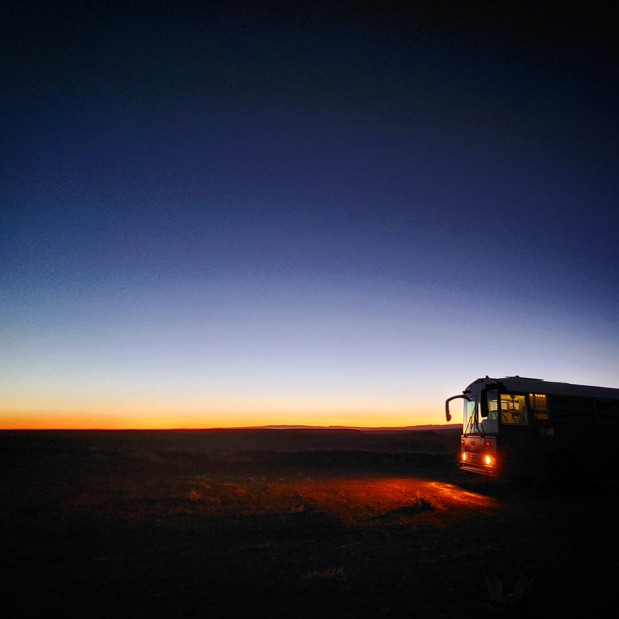 Skoolie on Dark Desert Morning