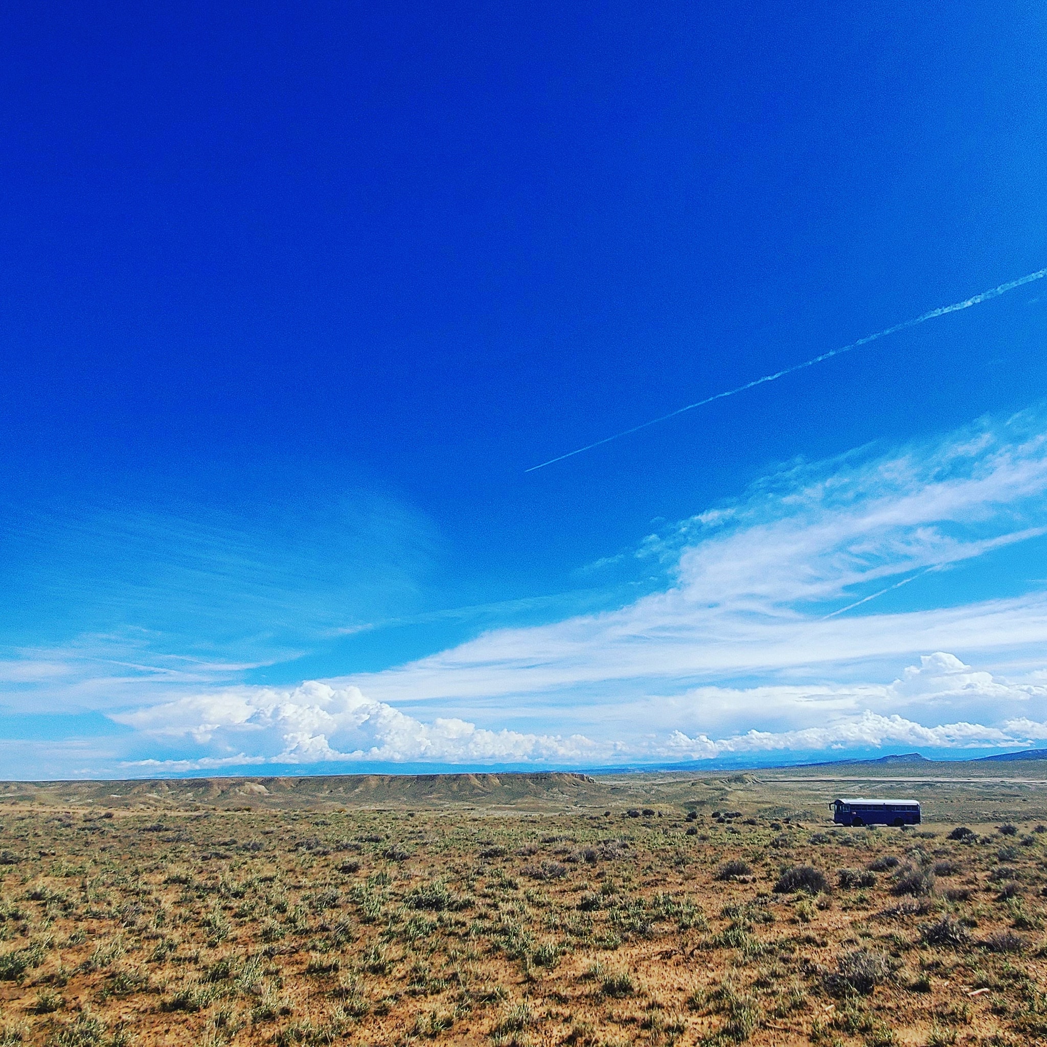 Skoolie Parked in Wide Open Utah Desert