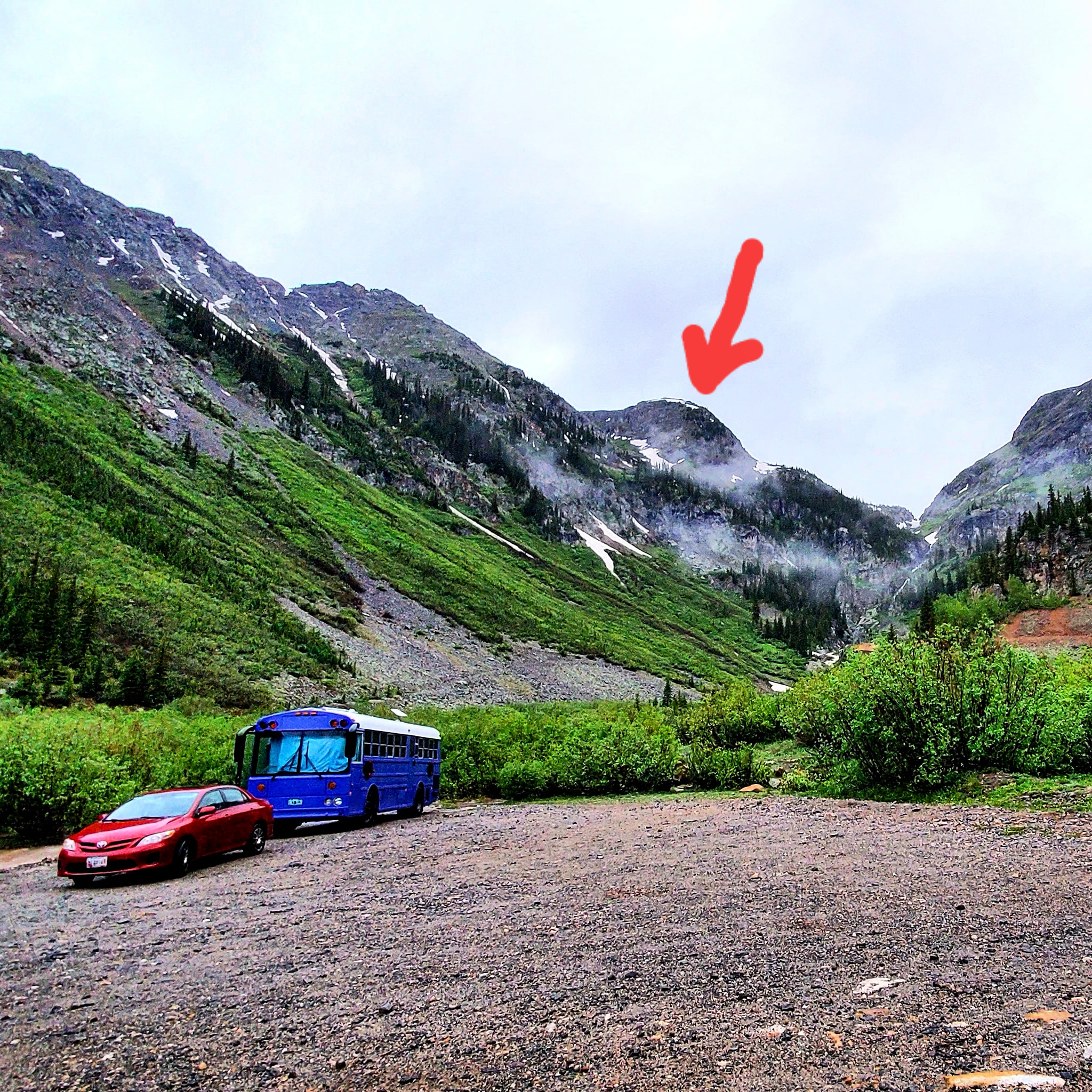 Skoolie Parked Under Overlook